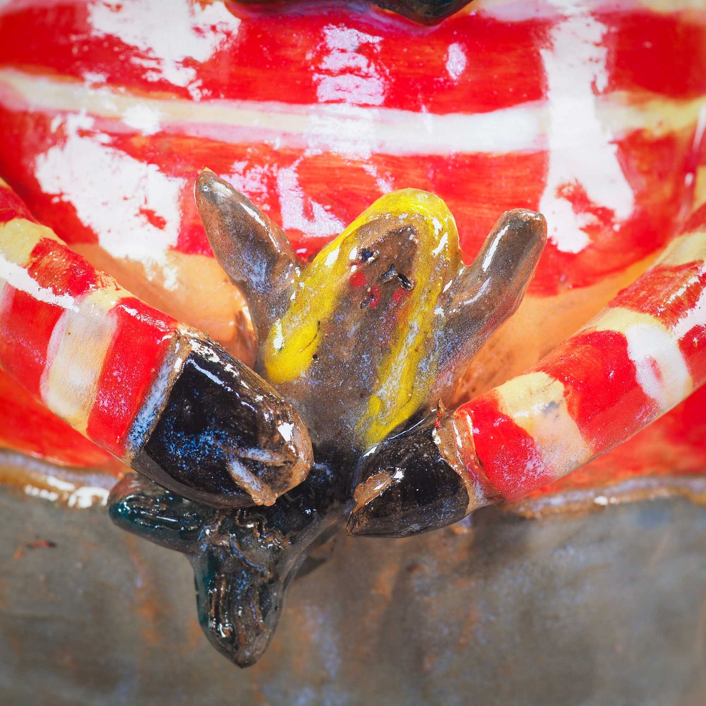 A handmade ceramic cat that loves fish... and mermaids! He is holding a cute little blond mermaid in his paws. Original ceramic sculpture by Idania Salcido.