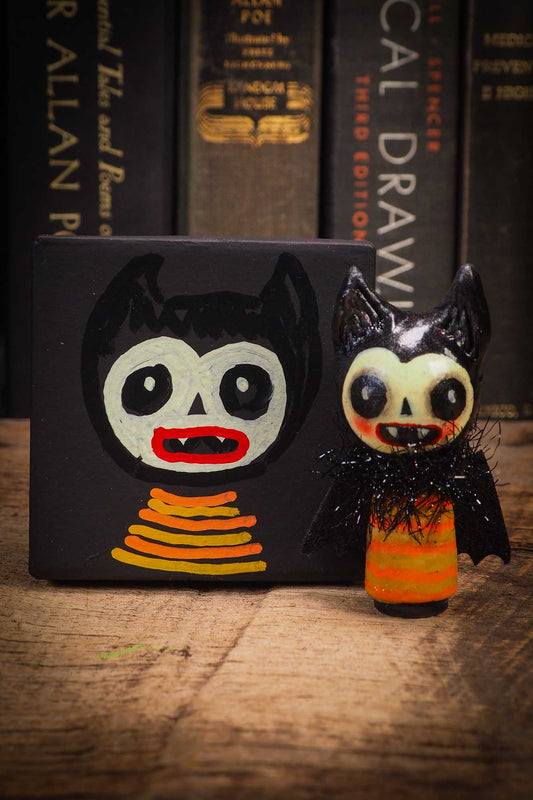 Small Halloween mini kokeshi art doll vampire figurine with sculpted head, fabric cape. Made by Idania Salcido, Danita Art.