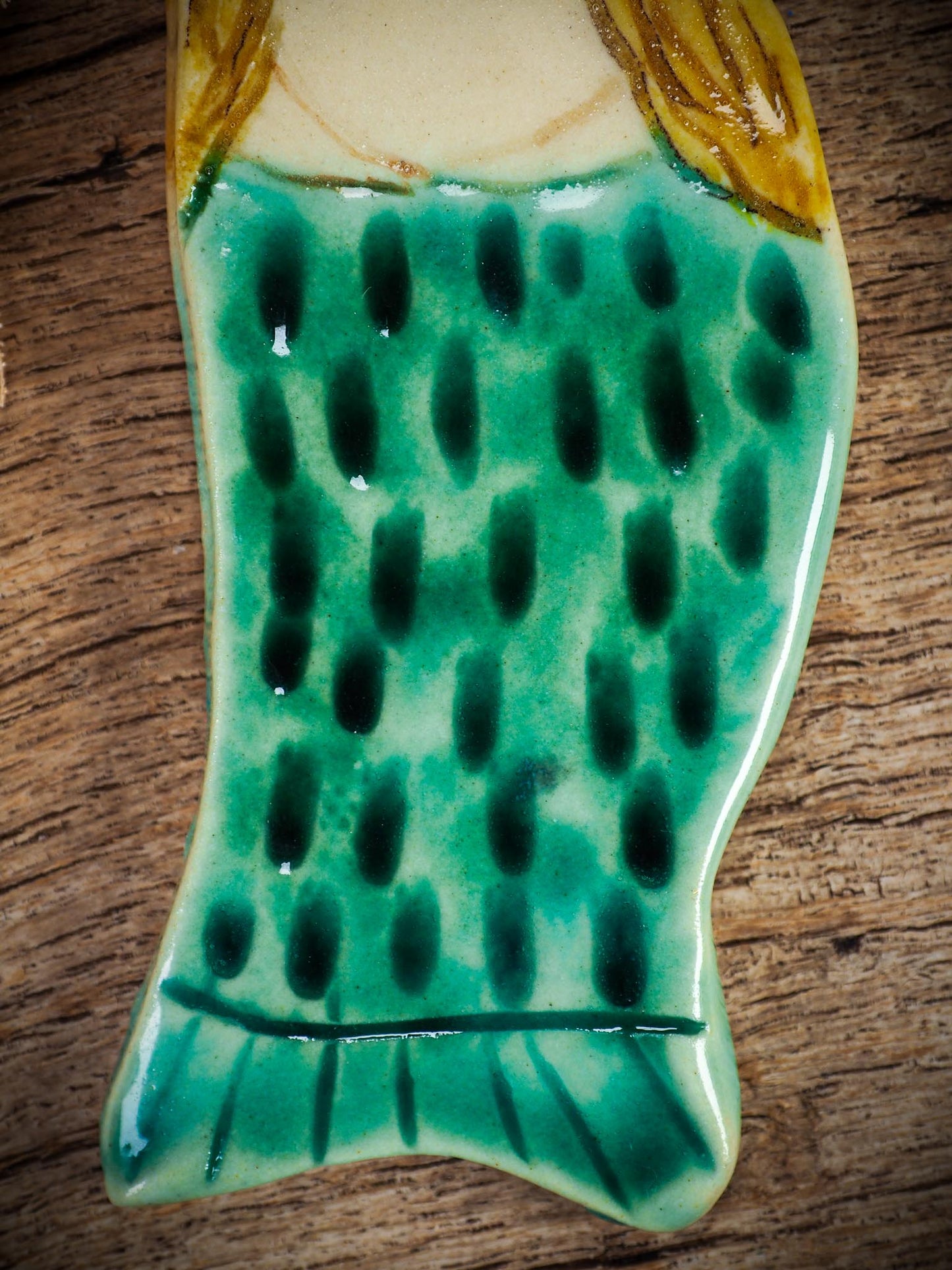 Handmade ceramic mermaid ornament with golden hair and blue-green tail, created by Idania Salcido aka Danita Art for holiday decorating or gifting.