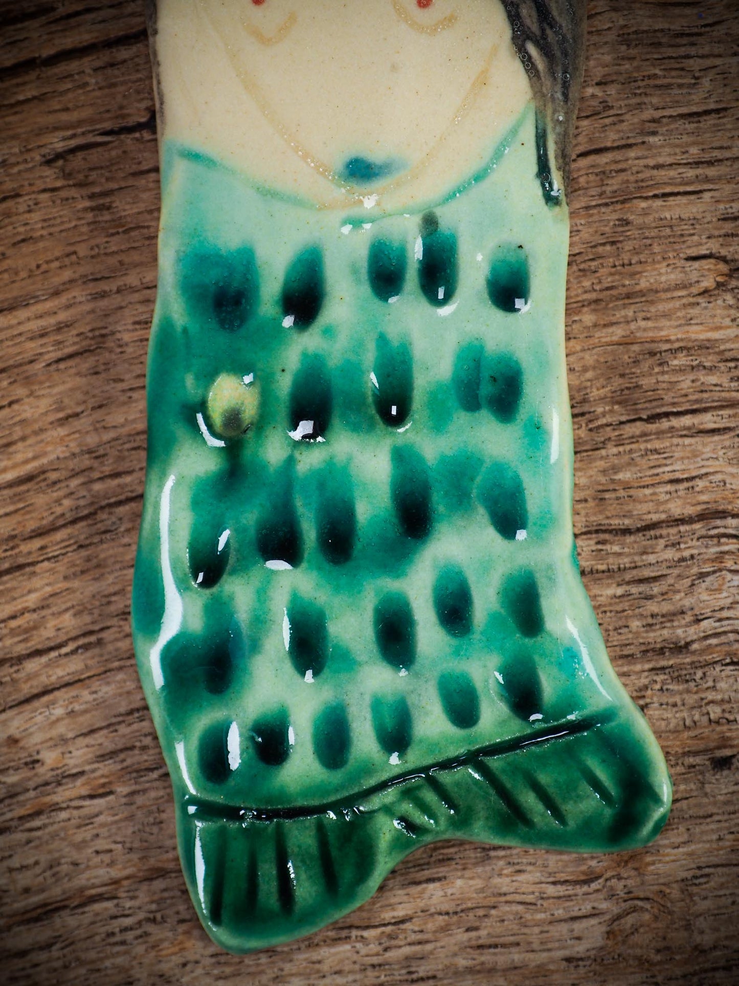 Handmade ceramic mermaid ornament with golden hair and blue-green tail, created by Idania Salcido aka Danita Art for holiday decorating or gifting.