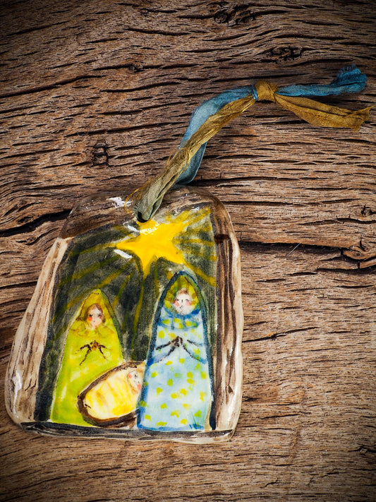 Handmade ceramic nativity ornament with painted figures and guiding star, created by Idania Salcido aka Danita Art for Christmas decoration or gifting.