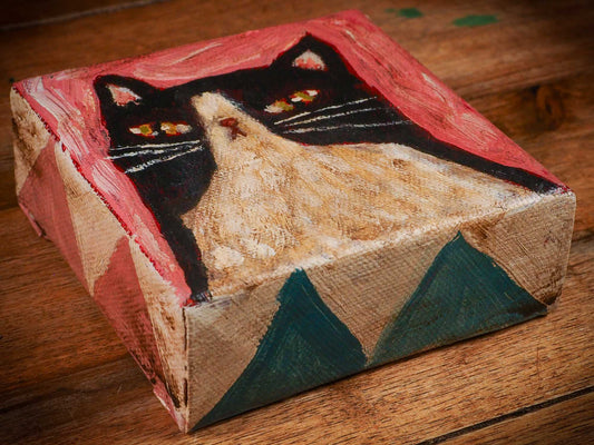 An original acrylic painting by Idania Salcido, Danita Art, depicting a tuxedo cat posing on a serious pose. A cat doing cat things.