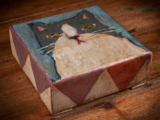 An original acrylic painting by Idania Salcido, Danita Art, depicting a grey cat posing on a serious pose. A cat doing cat things.