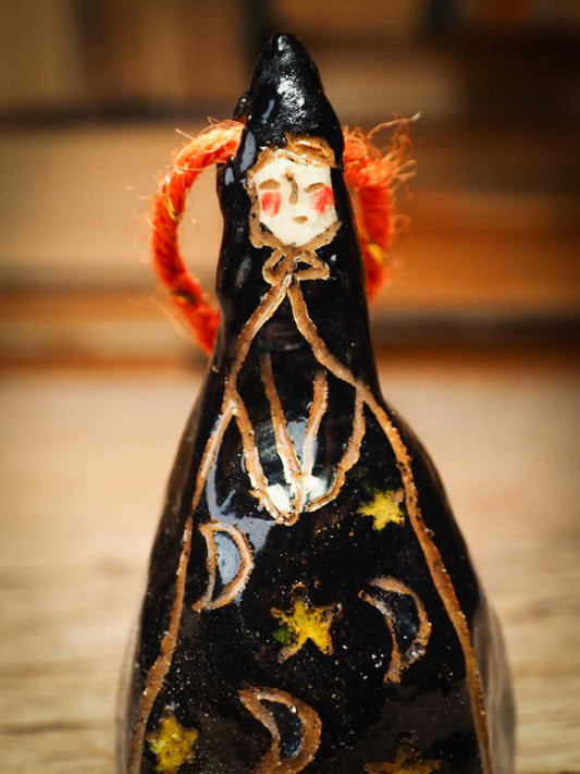 Original handmade ceramic black witch ornament by Idania Salcido Danita Art with thread is perfect Halloween decoration! Stands on its own or hangs from window