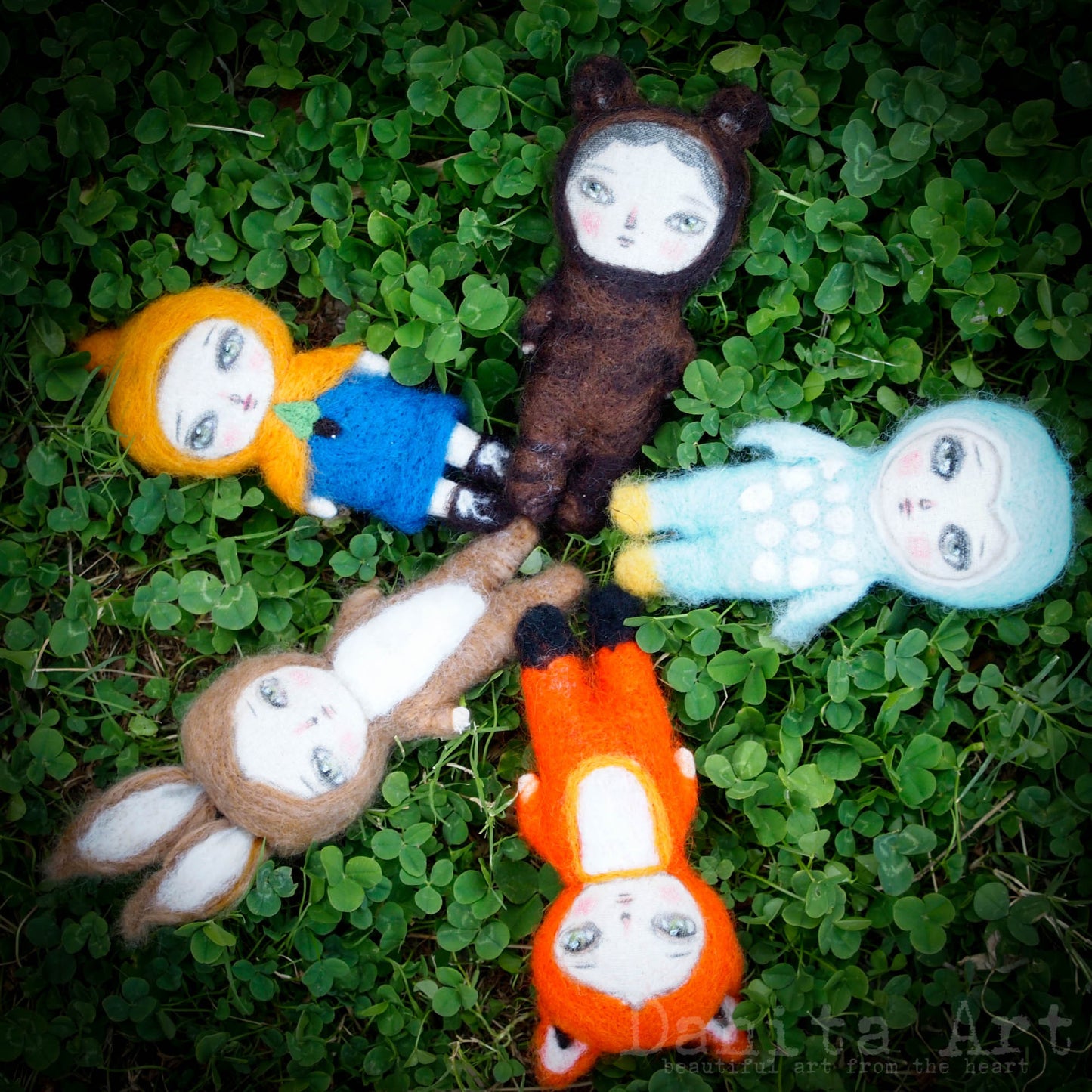 An amazing collection of hand crafted needle felting fabric and wool art dolls by the amazing mixed media artist and doll maker Danita Art