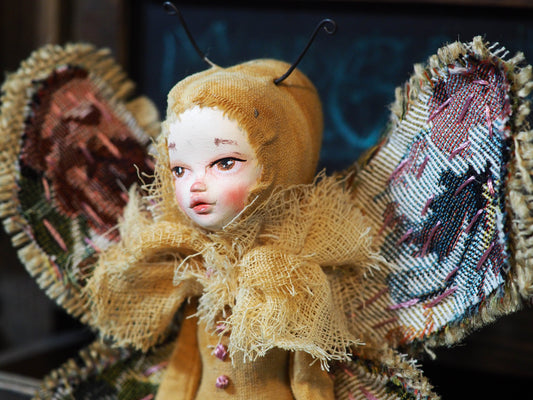 Inspired by nature, Danita created a handmade art doll moth, or night butterfly using organic materials like vintage and hand dyed fabric, wire and clay on a melancholic articulated soft sculpture. An art doll toy that celebrates nature's creations and the beautiful wings of insects with a bit of magic fairy on them.