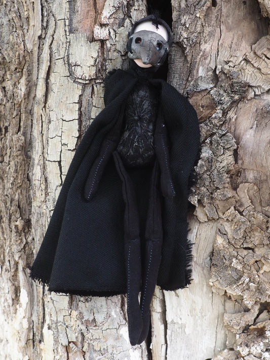 THE PLAGUE DOCTOR is a handmade Halloween art doll created by Danita Art. Using air dried clay, found fabrics and needle stitching for her body, Danita created an amazing original piece of work.
