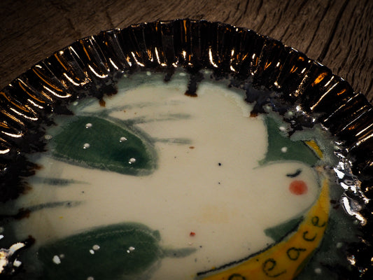 An original Christmas Holiday cake dinner dessert plate round glazed ceramic dinnerware handmade by Idania Salcido, the artist behind Danita Art. Glazed carved sgraffito stoneware, hand painted and decorated, it is illustrated by hand with snowmen, Christmas trees, Santa Claus, angels and snowballs and winter themes.