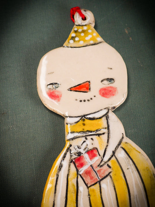 An original Christmas Holiday tree round glazed ceramic ornament handmade by Idania Salcido, the artist behind Danita Art. Glazed carved sgraffito stoneware, hand painted and decorated, it is illustrated by hand with snowmen, Christmas trees, Santa Claus, angels and snow balls and winter themes.