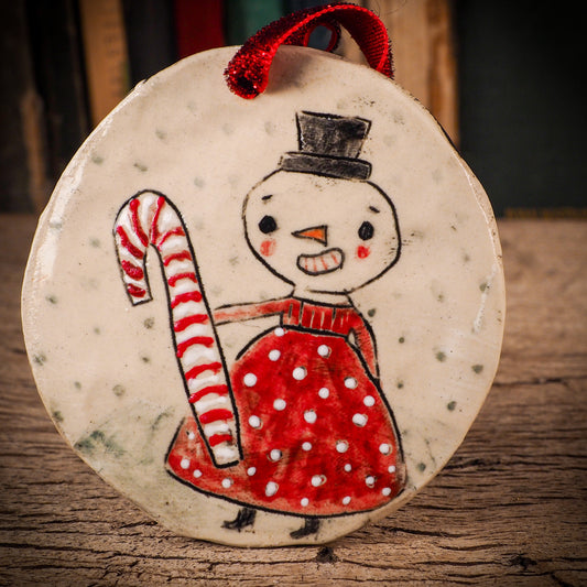 An original Christmas Holiday tree round glazed ceramic ornament handmade by Idania Salcido, the artist behind Danita Art. Glazed carved sgraffito stoneware, hand painted and decorated, it is illustrated by hand with winter scenes with snowmen, Christmas trees, Santa Claus, snow balls and winter themes.