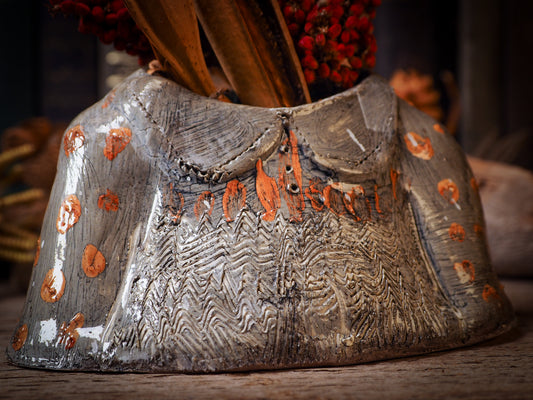 Using hand pinching techniques in of a kind fire glazed ceramics, Idania Salcido, the artist behind Danita Art, sculpted glazed ceramic clay vase containers and flower pots in the shape of vintage blouses. Beautiful accents for your dinner table, showcase or anywhere you want to remind you of family and love.