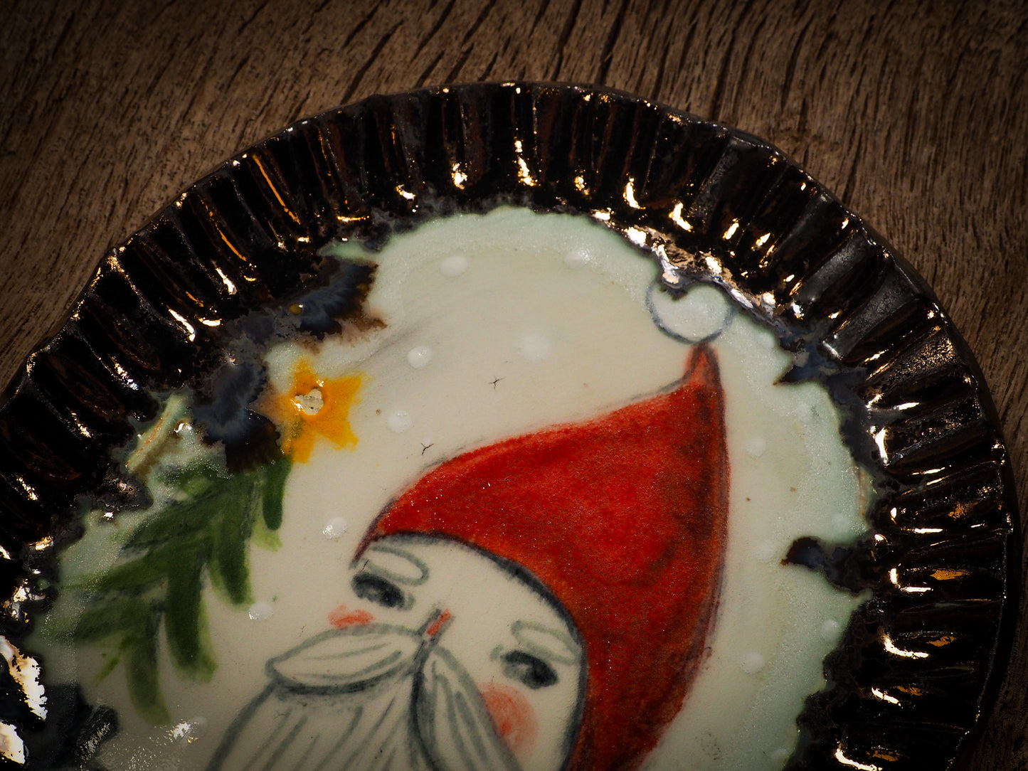An original Christmas Holiday cake dinner dessert plate round glazed ceramic dinnerware handmade by Idania Salcido, the artist behind Danita Art. Glazed carved sgraffito stoneware, hand painted and decorated, it is illustrated by hand with snowmen, Christmas trees, Santa Claus, angels and snowballs and winter themes.