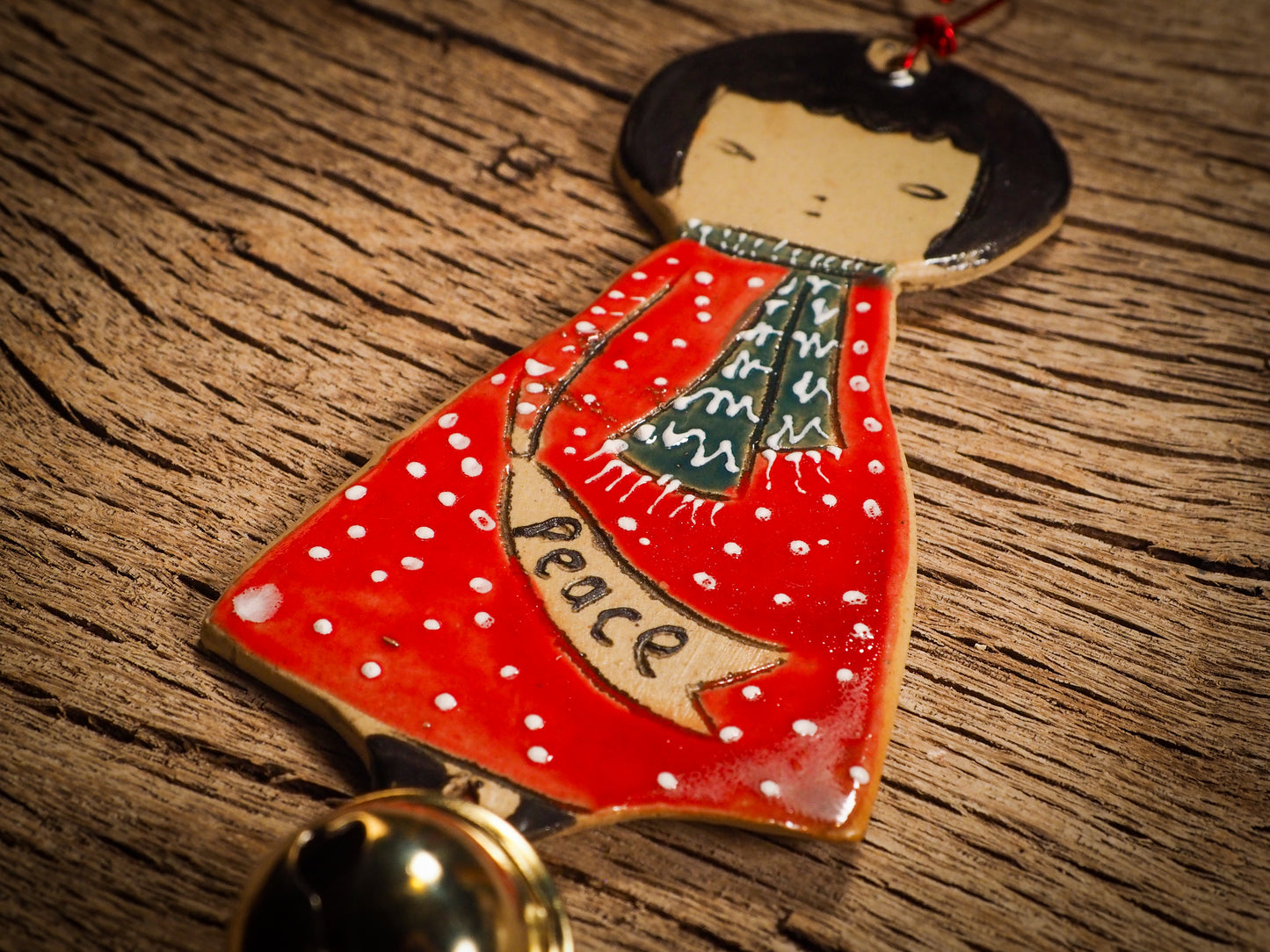 An original Christmas Holiday tree round glazed ceramic ornament handmade by Idania Salcido, the artist behind Danita Art. Glazed carved sgraffito stoneware, hand painted and decorated, it is illustrated by hand with snowmen, Christmas trees, Santa Claus, angels and snow balls and winter themes.
