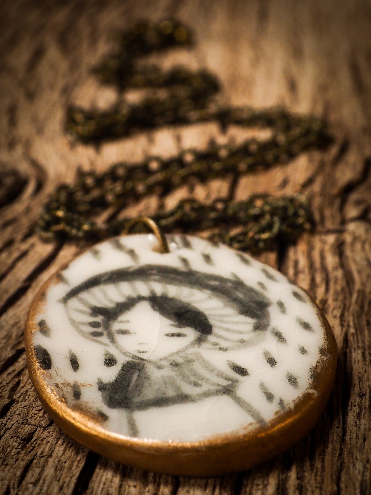 Unique fired ceramic porcelain necklace oval pendant by Idania Salcido, the artist behind Danita Art. Each jewelry setting is hand drawn and illustrated by the artist in her art studio, perfect for any dressing style. A casual gathering with friends or a fancy formal dinner, this necklace is a perfect fashion accessory.