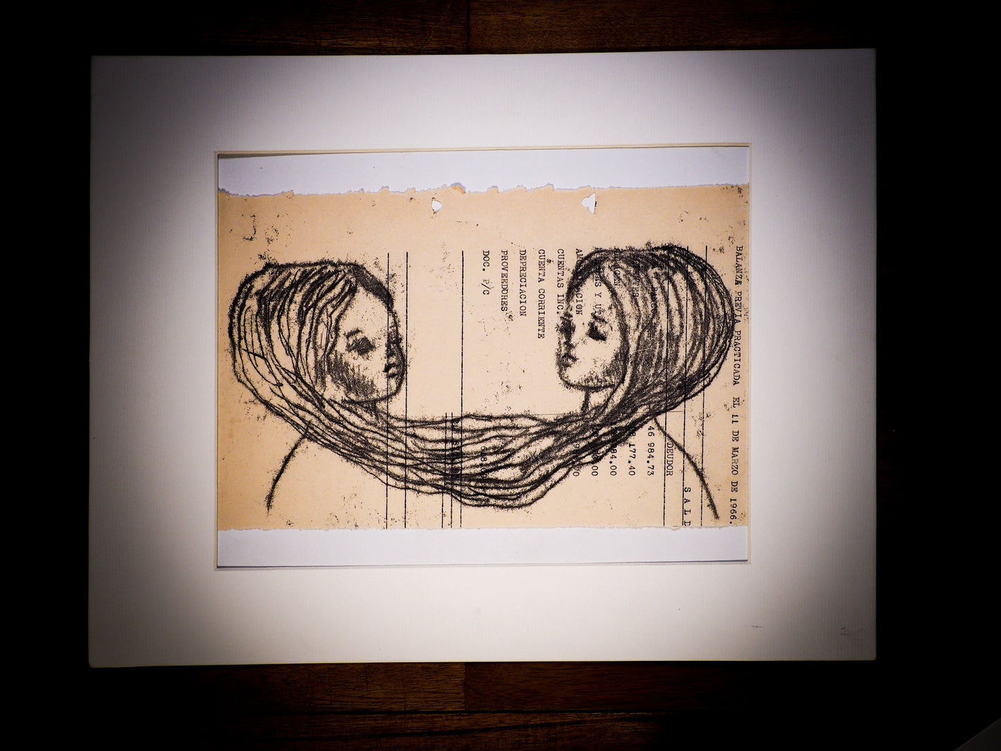 An original watercolor painting by Idania Salcido, the artist behind Danita Art. This is a beautiful monoprint, a one of a kind ink and vintage paper original art creation depicting two girls whose memories are tied by their hairs in a very surreal piece, painted on a mid 20th century ledger sheet with typewriter characters.
