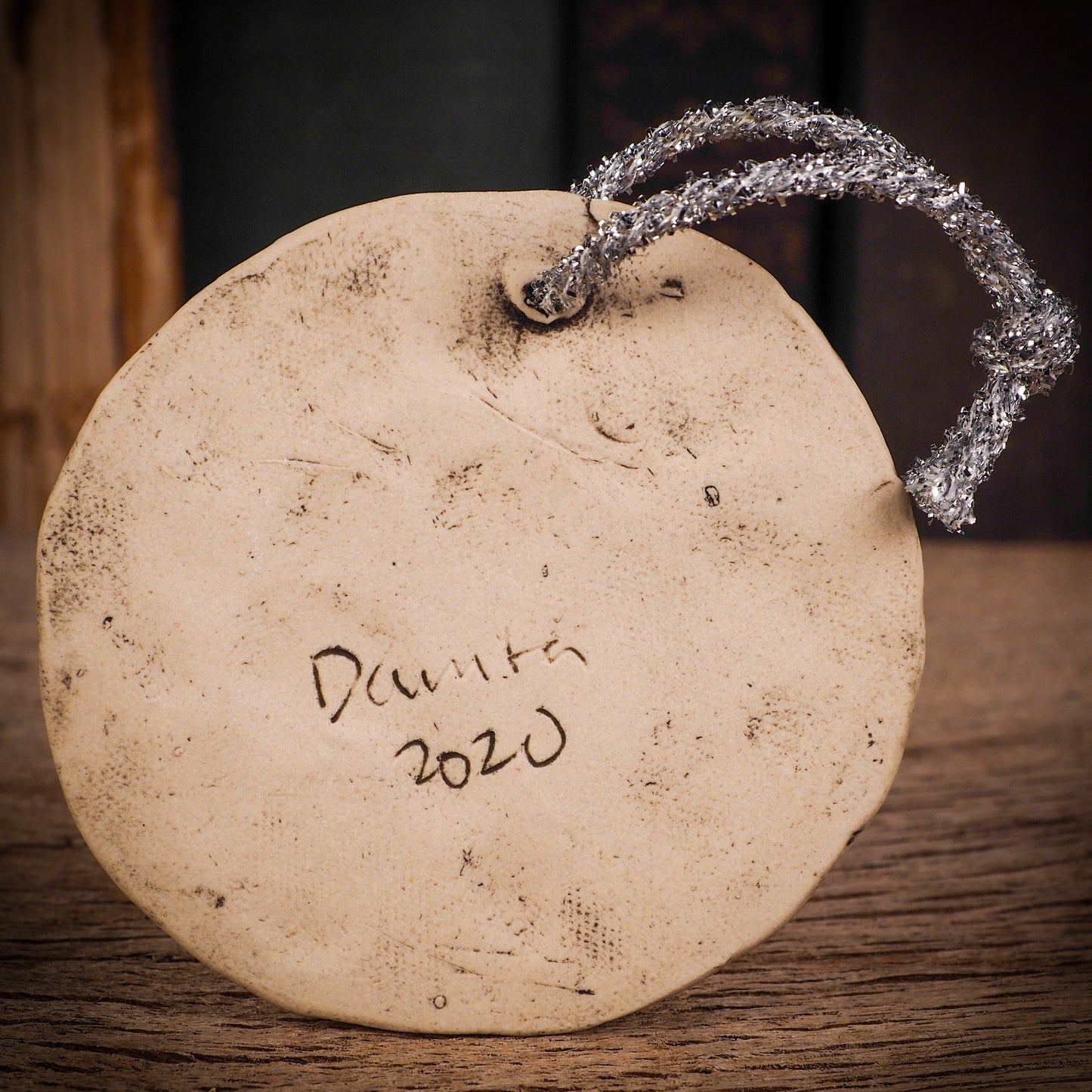 An original Christmas Holiday tree round glazed ceramic ornament handmade by Idania Salcido, the artist behind Danita Art. Glazed carved sgraffito stoneware, hand painted and decorated, it is illustrated by hand with winter scenes with snowmen, Christmas trees, Santa Claus, snow balls and winter themes.