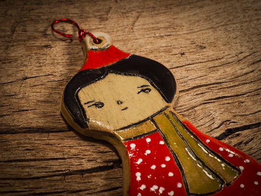An original Christmas Holiday tree round glazed ceramic ornament handmade by Idania Salcido, the artist behind Danita Art. Glazed carved sgraffito stoneware, hand painted and decorated, it is illustrated by hand with snowmen, Christmas trees, Santa Claus, angels and snow balls and winter themes.