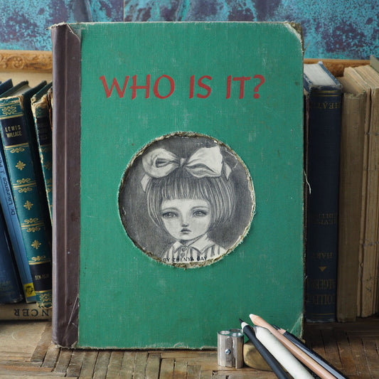 A beautiful mixed media altered book by Danita Art. One of her astonishing girls adorns the cover in a pencil and graphite drawing on the hard cover of an antique library book.