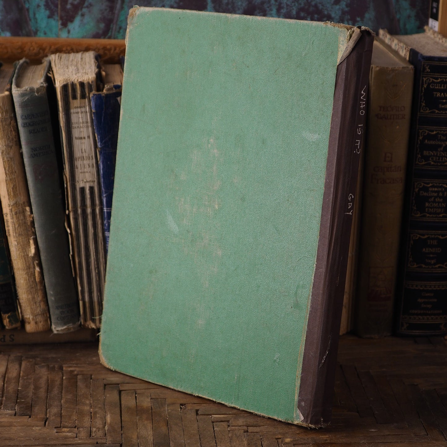 A beautiful mixed media altered book by Danita Art. One of her astonishing girls adorns the cover in a pencil and graphite drawing on the hard cover of an antique library book.