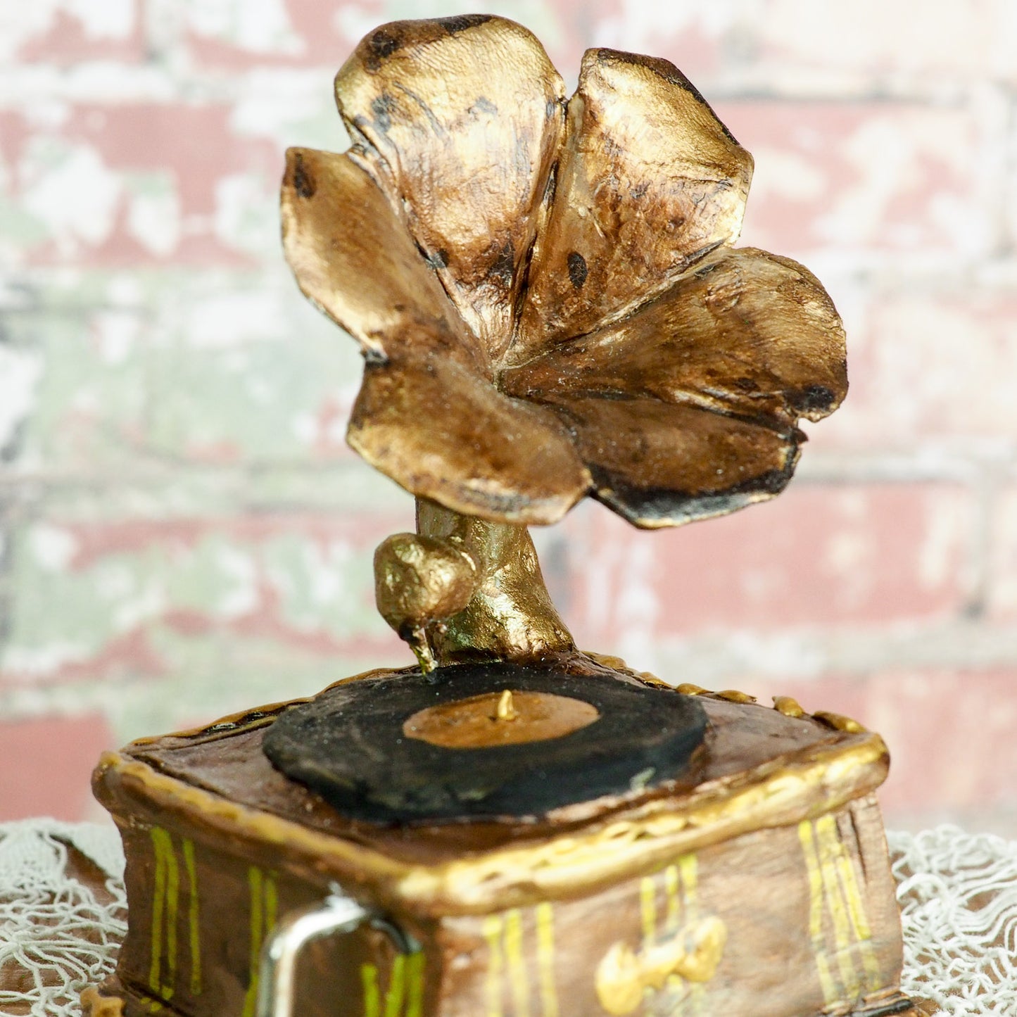 An original hand crafted art doll made by Danita. A blonde girl with a love for music, she plays her vintage vinyl records on her antique gramophone.