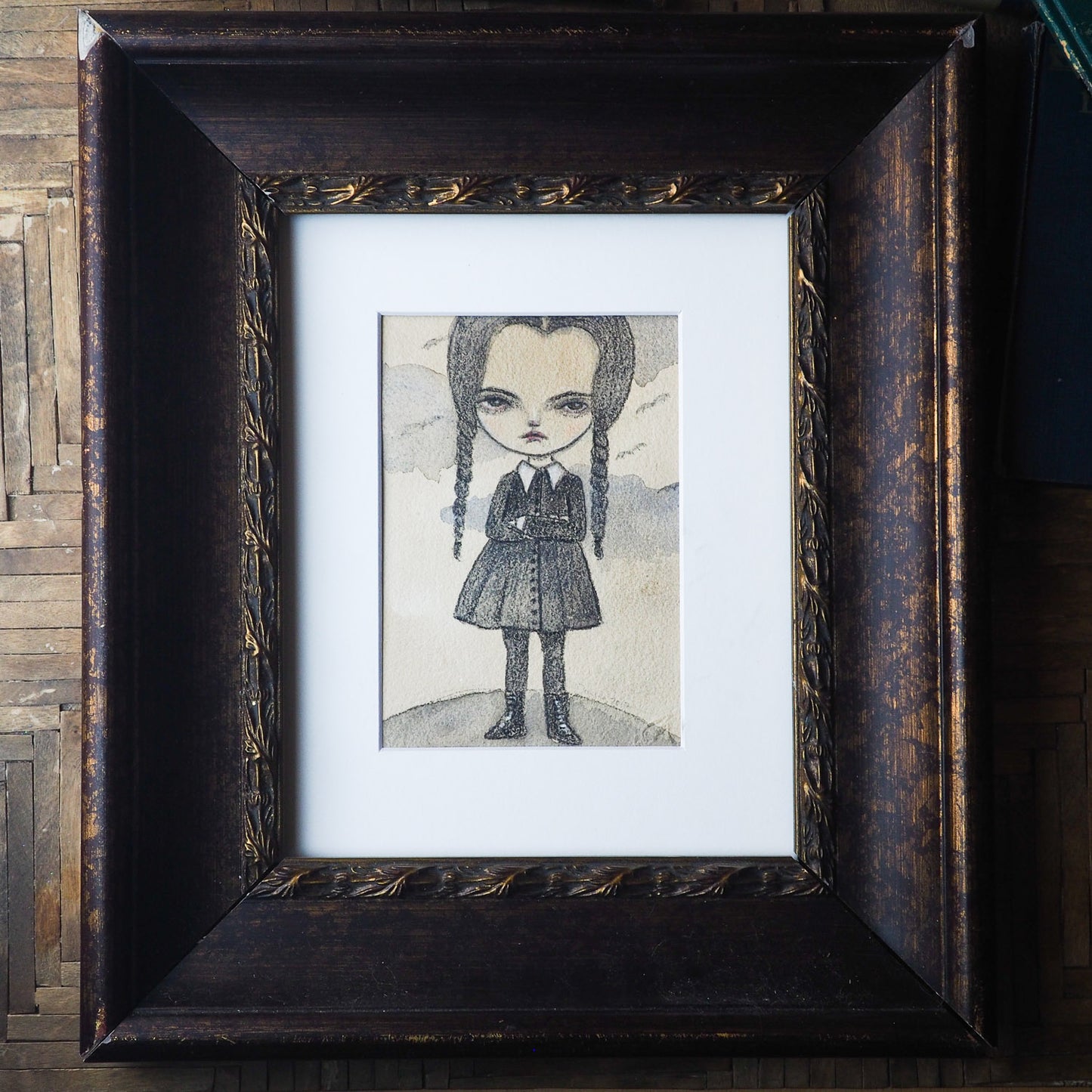 Wednesday Addams in watercolor and pencil by Danita. Creamy paper stands out this illustration on creamy paper. Great for Halloween decoration and any home decor.