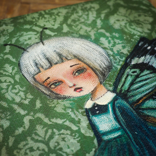 Danita butterfly surrealist folk art painting. Melancholic surreal illustration of moth woman in blue and green.