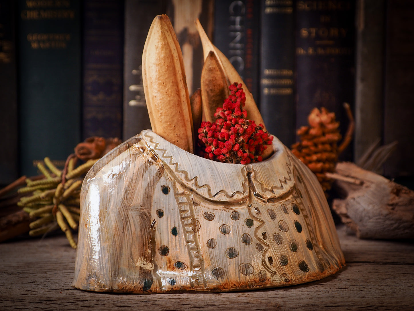 Using hand pinching techniques in of a kind fire glazed ceramics, Idania Salcido, the artist behind Danita Art, sculpted glazed ceramic clay vase containers and flower pots in the shape of vintage blouses. Beautiful accents for your dinner table, showcase or anywhere you want to remind you of family and love.