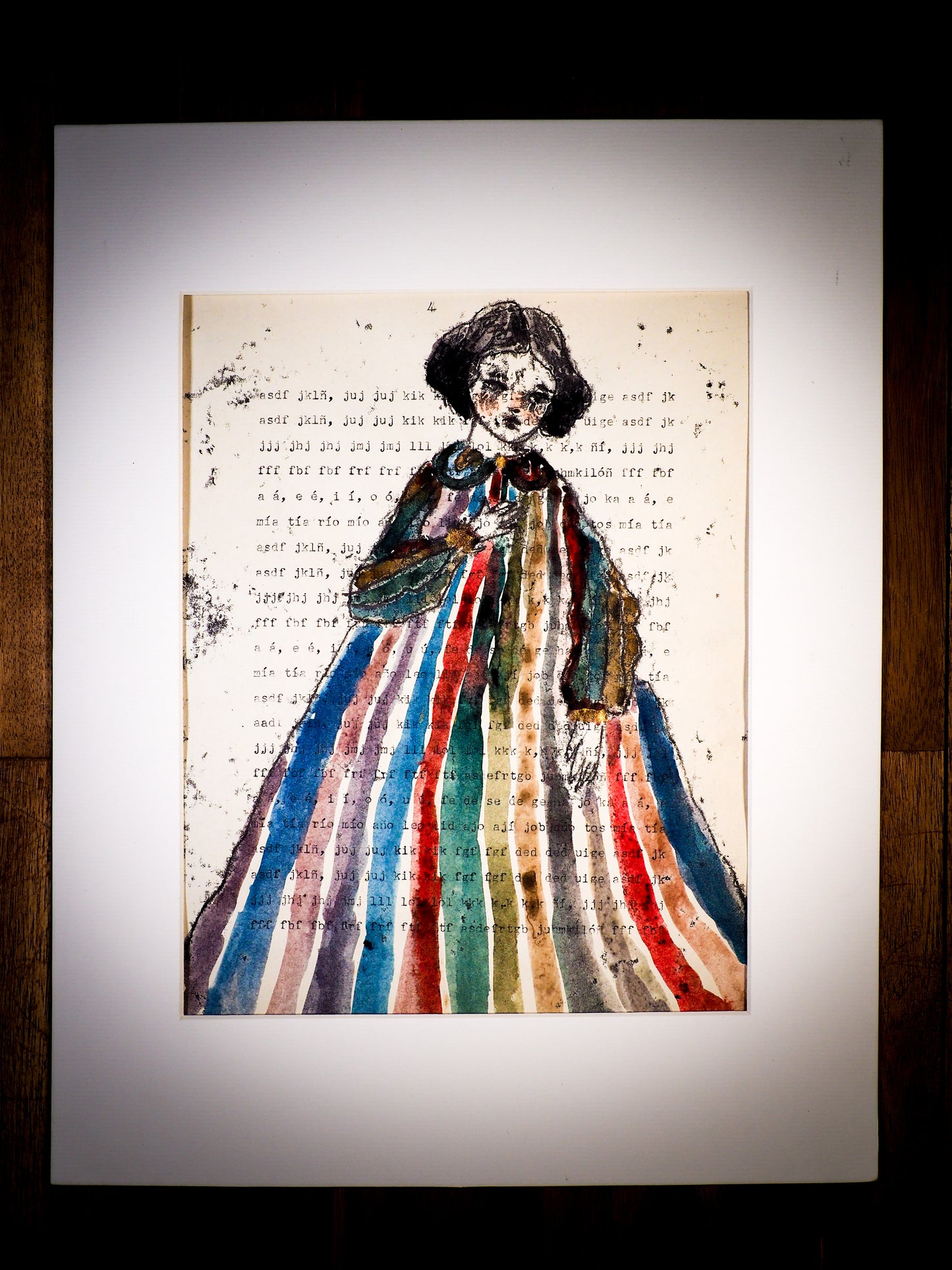 An original watercolor painting by Idania Salcido, the artist behind Danita Art. This is a beautiful monoprint, a one of a kind ink and vintage paper original art, a hand drawn girl in ink, wearing a colorful watercolor dress on mid 20th century typewriting class exercise.