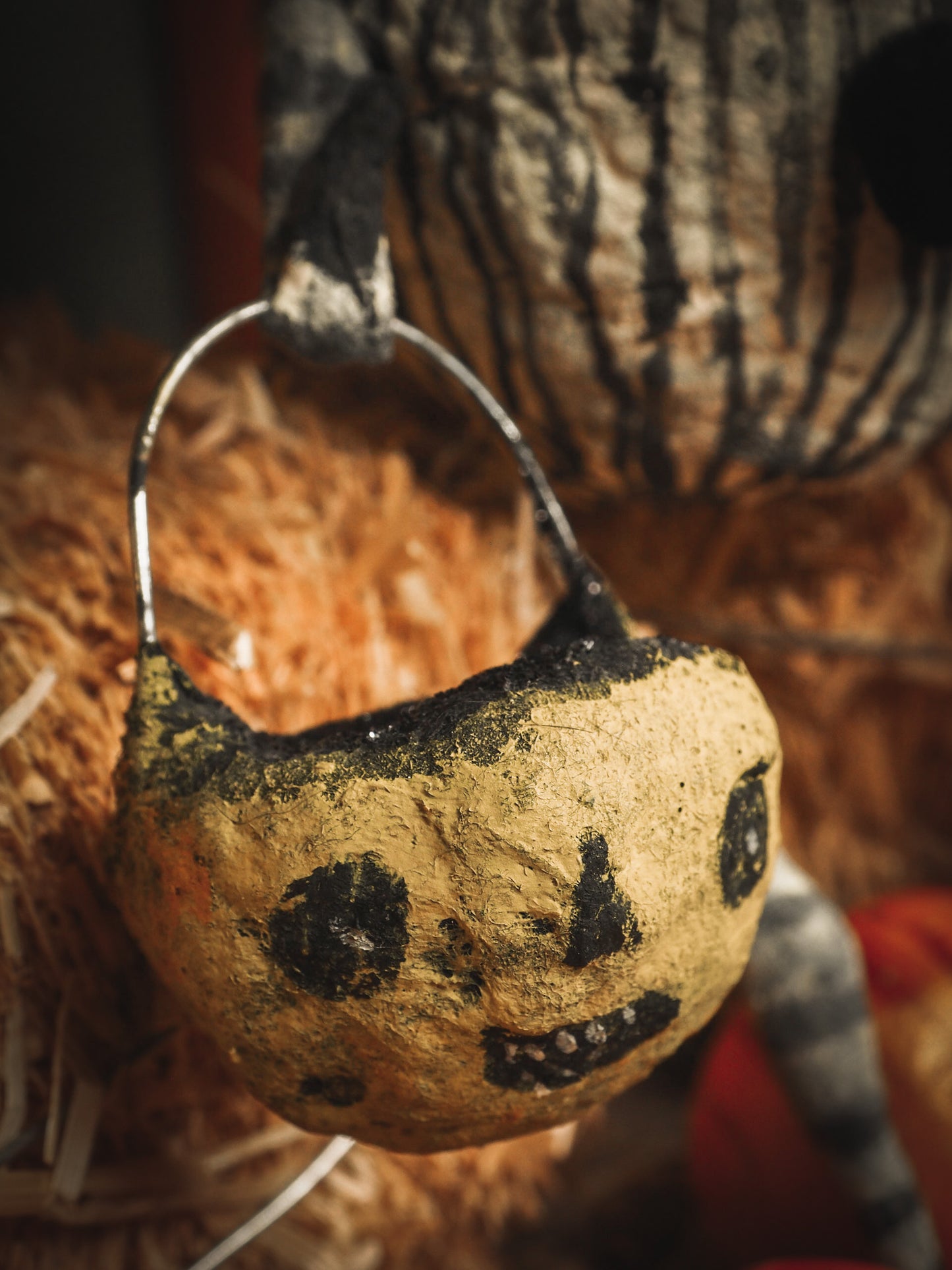 This adorable Halloween handmade ornament pumpkin jack-o-lantern doll monster by Idania Salcido, the artist behind Danita Art, is made with painted spun cotton and paper. It has hand painted face, teeth and eyes with a glittery paper had and matching paper costume. A Halloween home decoration on trick-or-treat night.