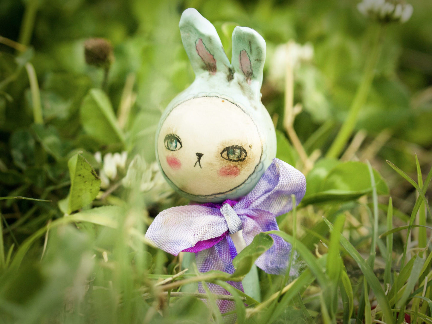 Adorable little handmade kokeshi Easter bunny rabbits are hopping along to Danita Art's studio, where she made them with wood and paper clay.