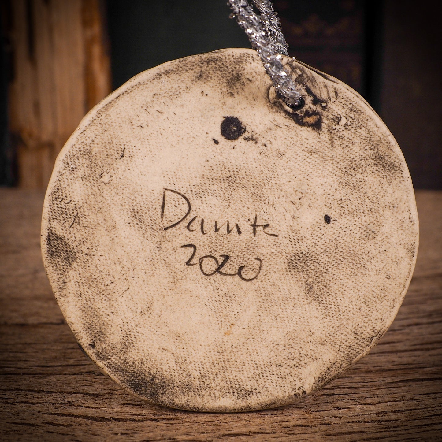 An original Christmas Holiday tree round glazed ceramic ornament handmade by Idania Salcido, the artist behind Danita Art. Glazed carved sgraffito stoneware, hand painted and decorated, it is illustrated by hand with winter scenes with snowmen, Christmas trees, Santa Claus, snow balls and winter themes.