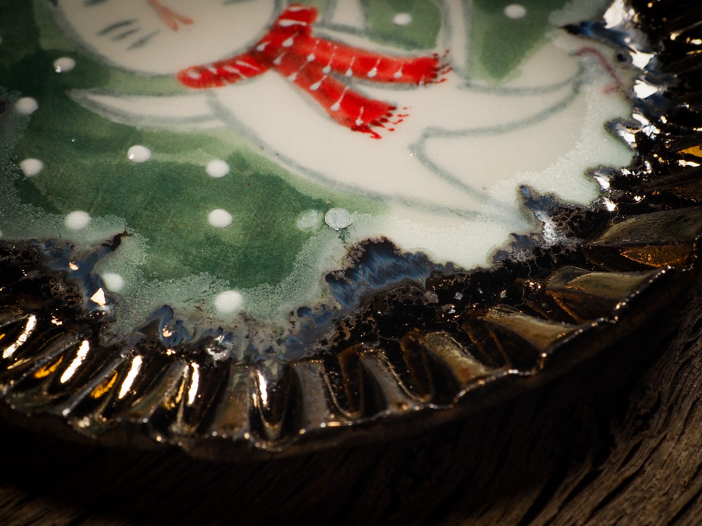 An original Christmas Holiday cake dinner dessert plate round glazed ceramic dinnerware handmade by Idania Salcido, the artist behind Danita Art. Glazed carved sgraffito stoneware, hand painted and decorated, it is illustrated by hand with snowmen, Christmas trees, Santa Claus, angels and snowballs and winter themes.