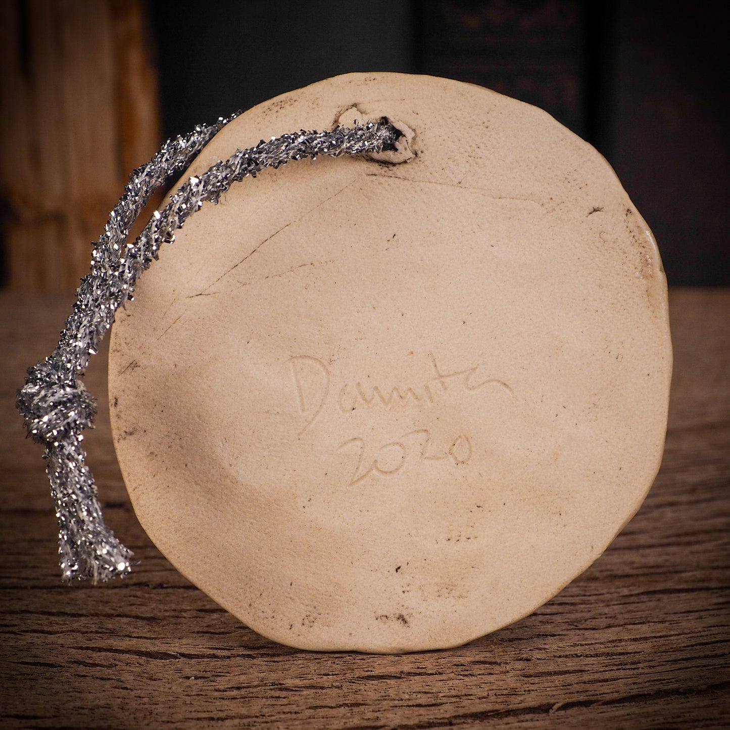 An original Christmas Holiday tree round glazed ceramic ornament handmade by Idania Salcido, the artist behind Danita Art. Glazed carved sgraffito stoneware, hand painted and decorated, it is illustrated by hand with winter scenes with snowmen, Christmas trees, Santa Claus, snow balls and winter themes.