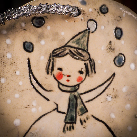 An original Christmas Holiday tree round glazed ceramic ornament handmade by Idania Salcido, the artist behind Danita Art. Glazed carved sgraffito stoneware, hand painted and decorated, it is illustrated by hand with winter scenes with snowmen, Christmas trees, Santa Claus, snow balls and winter themes.
