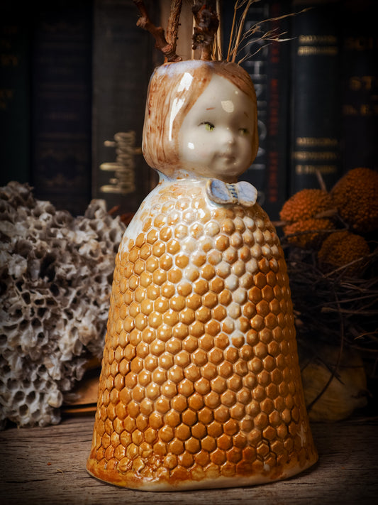 Original handmade ceramic flower vase, artist brush and pencil holder by Idania Salcido, Danita Art. A honeycomb bee shaped statue with china doll head. Handmade touch to any artist's studio with handmade glazed ceramic good for watercolors acrylics inks and oil paints. Clean with water or mineral spirits.