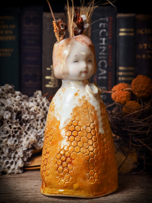 Original handmade ceramic flower vase, artist brush and pencil holder by Idania Salcido, Danita Art. A honeycomb bee shaped statue with china doll head. Handmade touch to any artist's studio with handmade glazed ceramic good for watercolors acrylics inks and oil paints. Clean with water or mineral spirits.