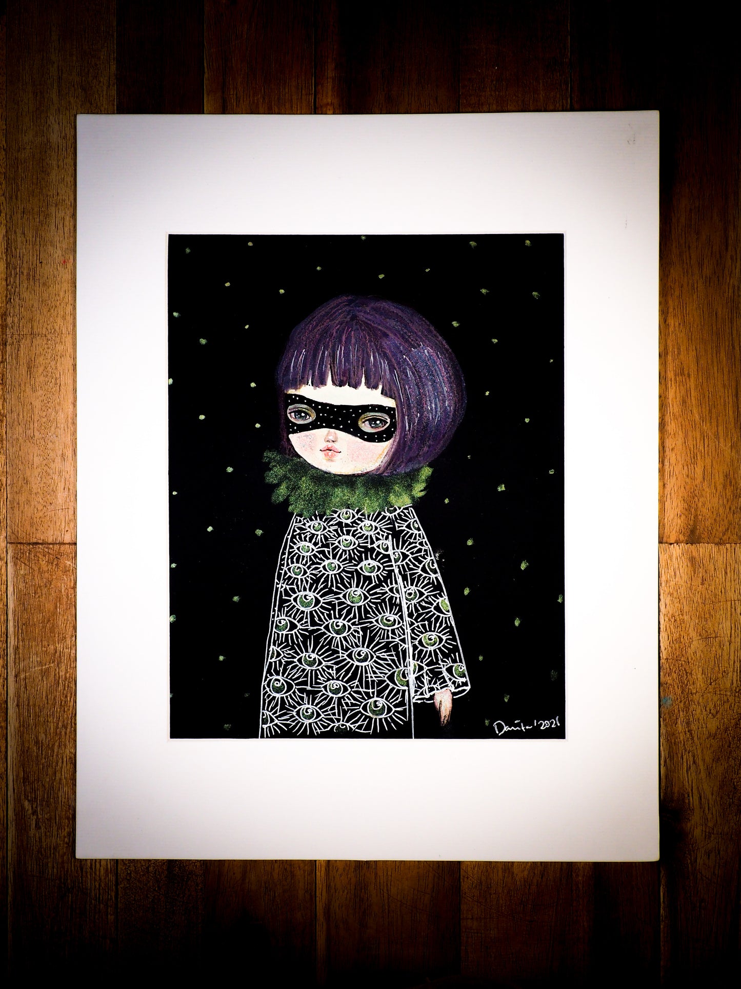 An original watercolor painting by Idania Salcido, the artist behind Danita Art. This is a beautiful mixed media, a with with eyes all over her black dress, wearing a black mask over her eyes. She is very mysterious, don’t you think? Painted in mixed media, acrylics, inks and pastels on watercolor paper.