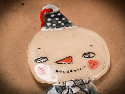 An original Christmas Holiday tree round glazed ceramic ornament handmade by Idania Salcido, the artist behind Danita Art. Glazed carved sgraffito stoneware, hand painted and decorated, it is illustrated by hand with snowmen, Christmas trees, Santa Claus, angels and snow balls and winter themes.