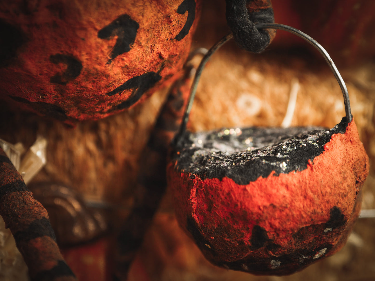 This adorable Halloween handmade ornament pumpkin jack-o-lantern doll monster by Idania Salcido, the artist behind Danita Art, is made with painted spun cotton and paper. It has hand painted face, teeth and eyes with a glittery paper had and matching paper costume. A Halloween home decoration on trick-or-treat night.