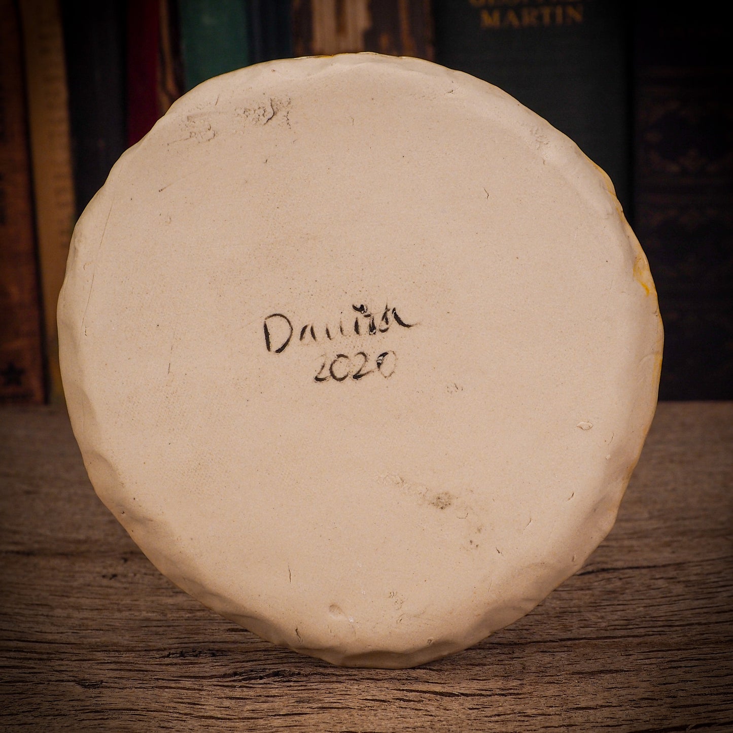 An original Christmas Holiday cake dinner plate round glazed ceramic dinnerware handmade by Idania Salcido, the artist behind Danita Art. Glazed carved sgraffito stoneware, hand painted and decorated, it is illustrated by hand with snowmen, Christmas trees, Santa Claus, angels and snow balls and winter themes.