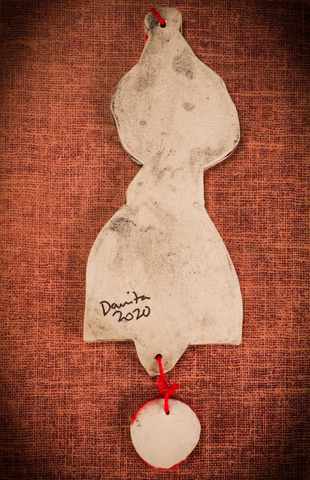 An original Christmas Holiday tree round glazed ceramic ornament handmade by Idania Salcido, the artist behind Danita Art. Glazed carved sgraffito stoneware, hand painted and decorated, it is illustrated by hand with snowmen, Christmas trees, Santa Claus, angels and snow balls and winter themes.