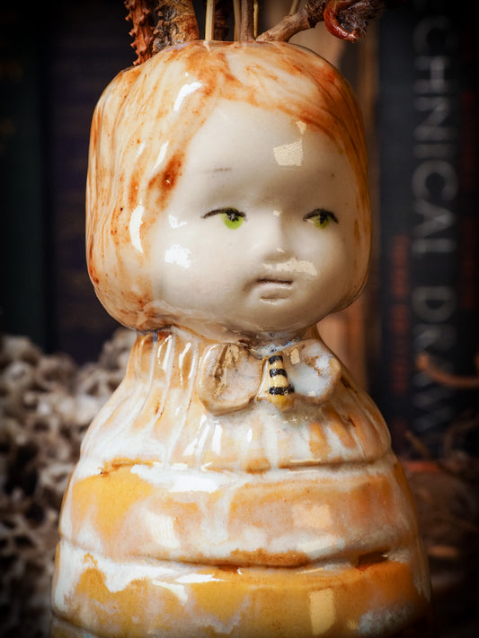 Original handmade ceramic flower vase, artist brush and pencil holder by Idania Salcido, Danita Art. A honeycomb bee shaped statue with china doll head. Handmade touch to any artist's studio with handmade glazed ceramic good for watercolors acrylics inks and oil paints. Clean with water or mineral spirits.