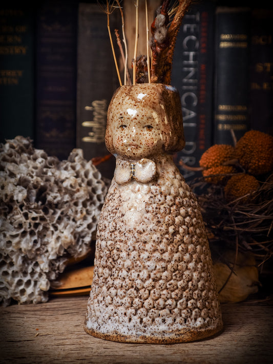 Original handmade ceramic flower vase, artist brush and pencil holder by Idania Salcido, Danita Art. A honeycomb bee shaped statue with china doll head. Handmade touch to any artist's studio with handmade glazed ceramic good for watercolors acrylics inks and oil paints. Clean with water or mineral spirits.