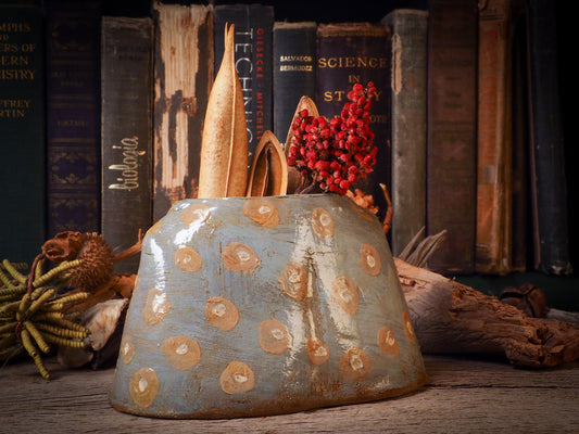 Using hand pinching techniques in of a kind fire glazed ceramics, Idania Salcido, the artist behind Danita Art, sculpted glazed ceramic clay vase containers and flower pots in the shape of vintage blouses. Beautiful accents for your dinner table, showcase or anywhere you want to remind you of family and love.