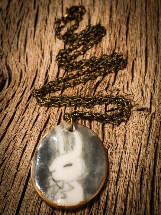 Unique fired ceramic porcelain necklace oval pendant by Idania Salcido, the artist behind Danita Art. Each jewelry setting is hand drawn and illustrated by the artist in her art studio, perfect for any dressing style. A casual gathering with friends or a fancy formal dinner, this necklace is a perfect fashion accessory.