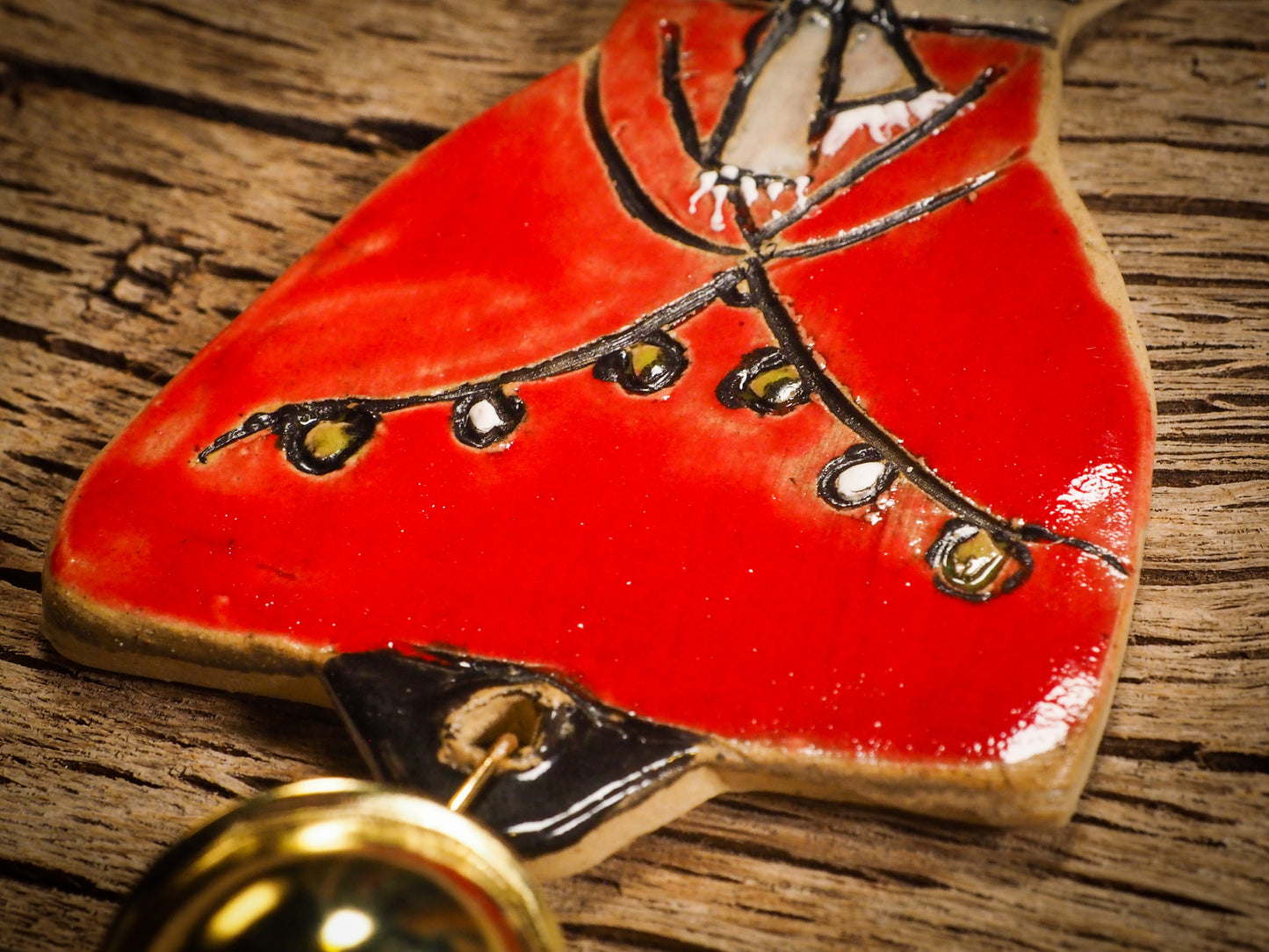 An original Christmas Holiday tree round glazed ceramic ornament handmade by Idania Salcido, the artist behind Danita Art. Glazed carved sgraffito stoneware, hand painted and decorated, it is illustrated by hand with snowmen, Christmas trees, Santa Claus, angels and snow balls and winter themes.