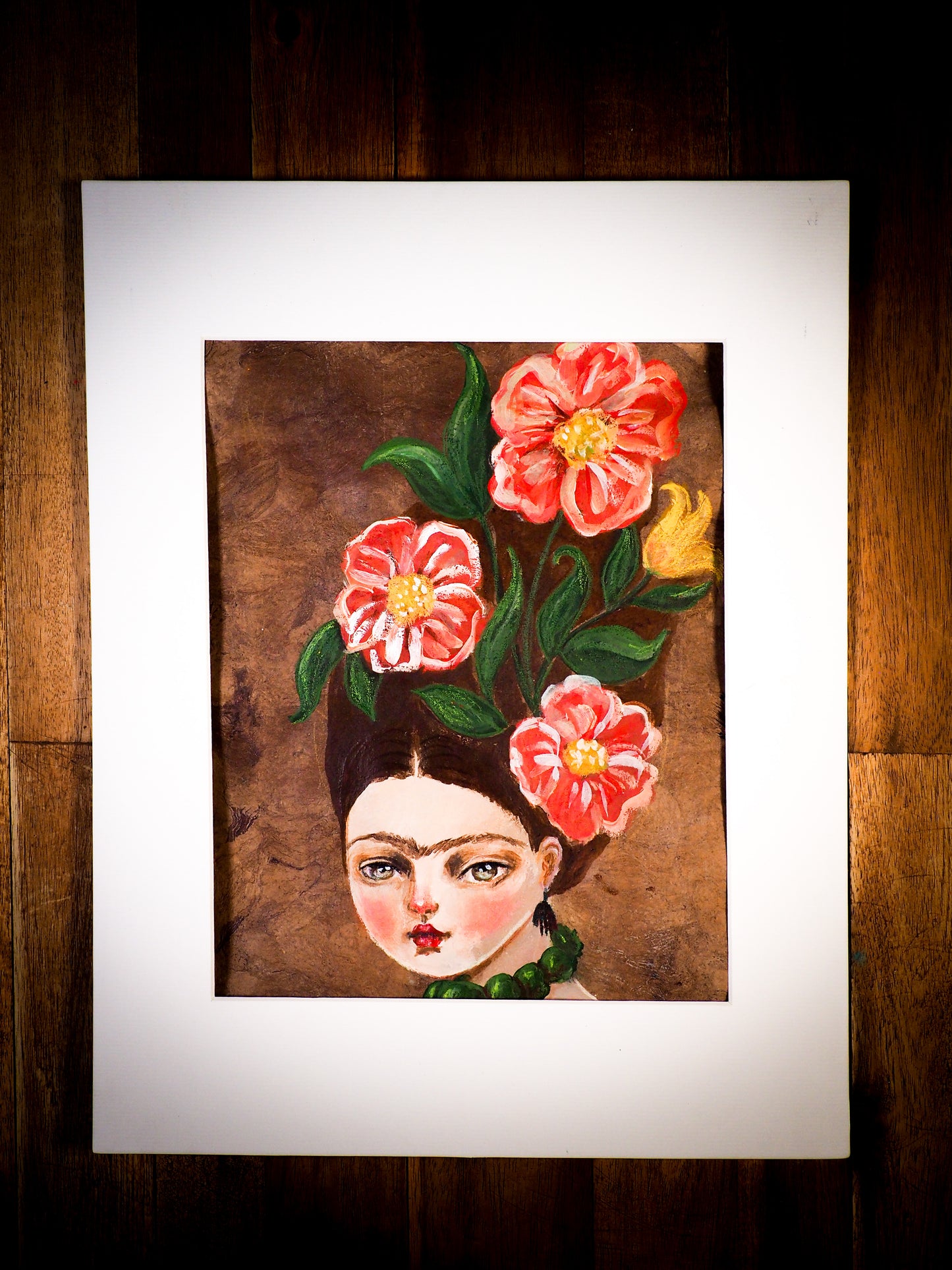 An original watercolor painting by Idania Salcido, the artist behind Danita Art. This is a beautiful mixed media painting, Frida Khalo wearing a high hairdo with beautiful hand painted red flowers in her hair. Painted in mixed media, acrylics, inks and pastels on special handmade paper.