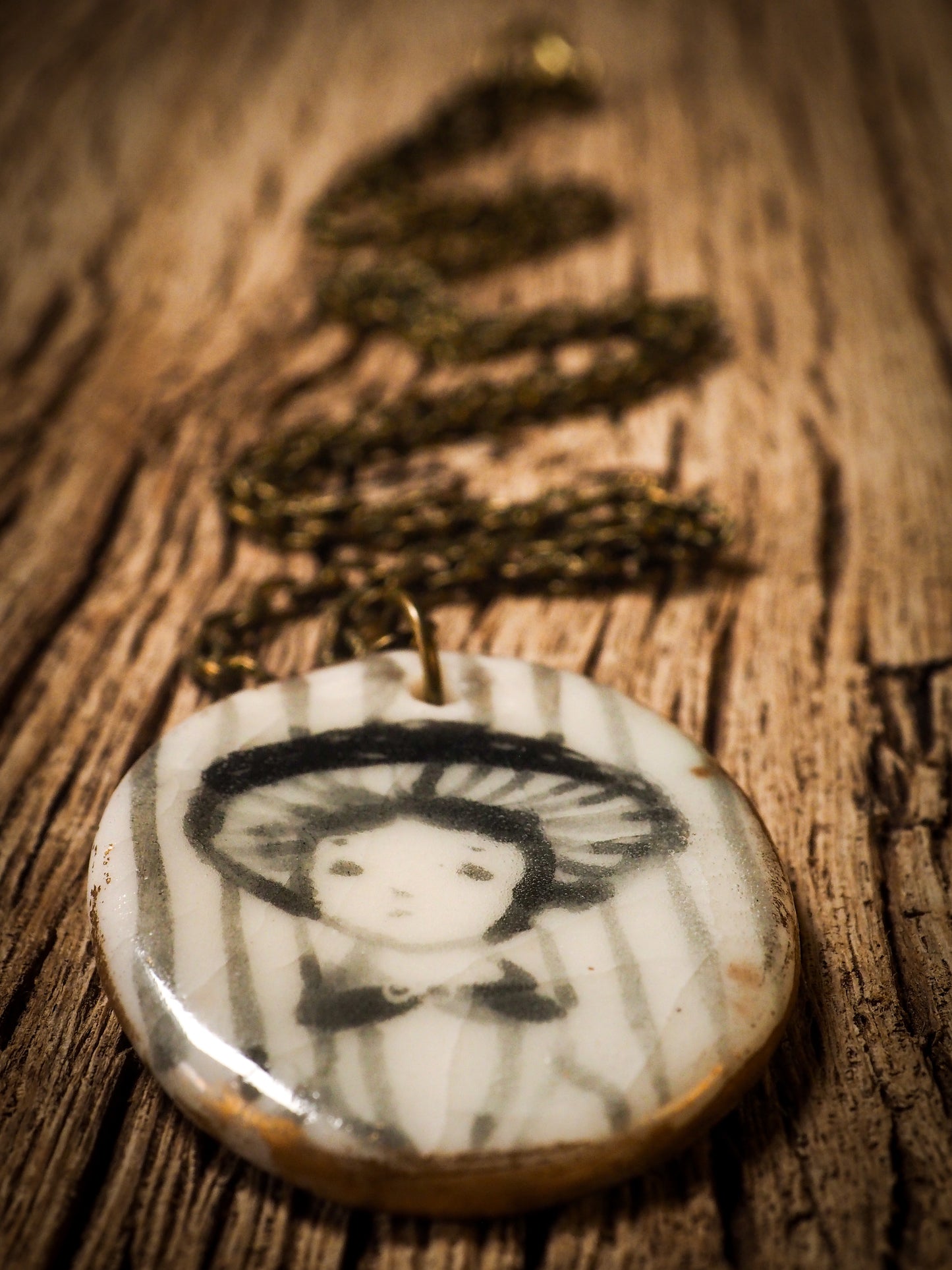 Unique fired ceramic porcelain necklace oval pendant by Idania Salcido, the artist behind Danita Art. Each jewelry setting is hand drawn and illustrated by the artist in her art studio, perfect for any dressing style. A casual gathering with friends or a fancy formal dinner, this necklace is a perfect fashion accessory.