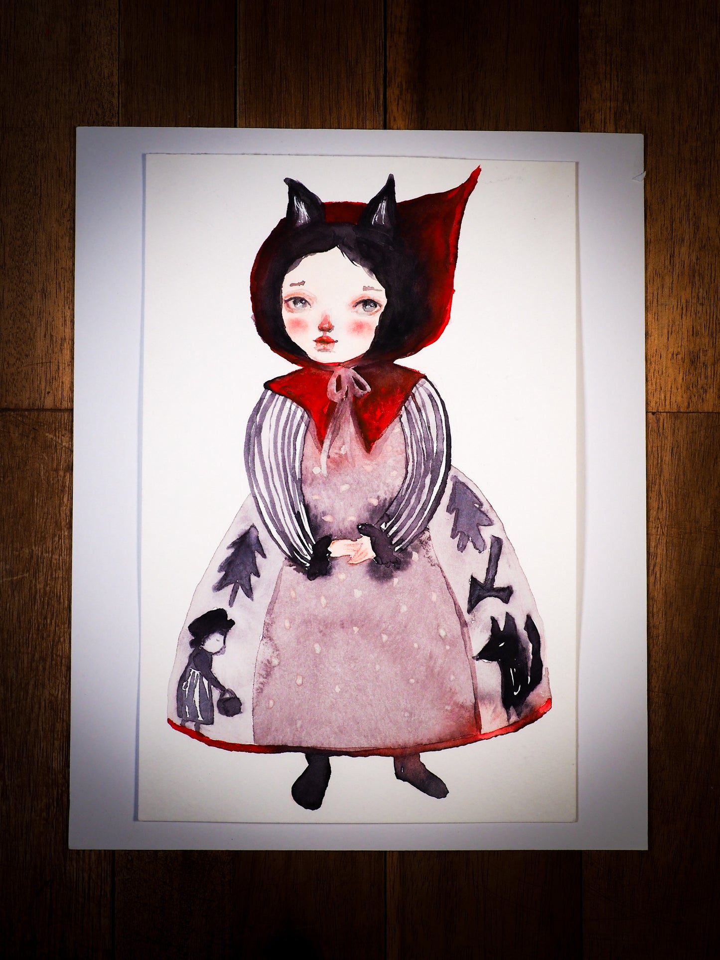 An original mixed media watercolor by Idania Salcido, the artist behind Danita Art. This is a beautiful mixed media painting, iNapier’s by the story of Lit le Red Riding Hood. Painted with watercolors over watercolor paper.