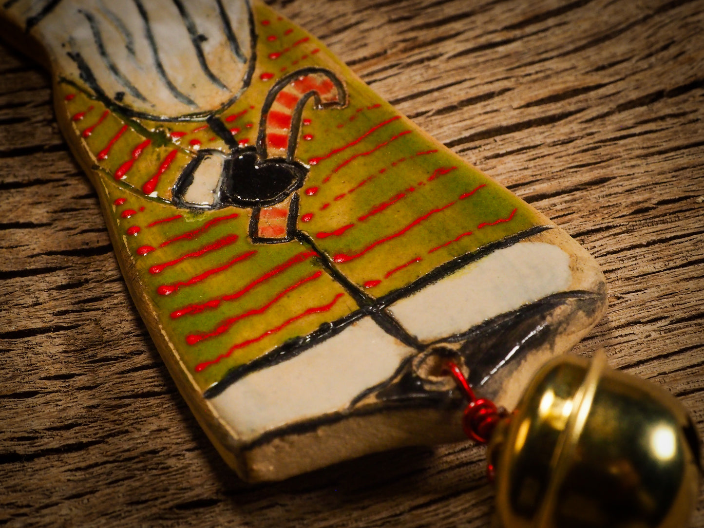 An original Christmas Holiday tree round glazed ceramic ornament handmade by Idania Salcido, the artist behind Danita Art. Glazed carved sgraffito stoneware, hand painted and decorated, it is illustrated by hand with snowmen, Christmas trees, Santa Claus, angels and snow balls and winter themes.